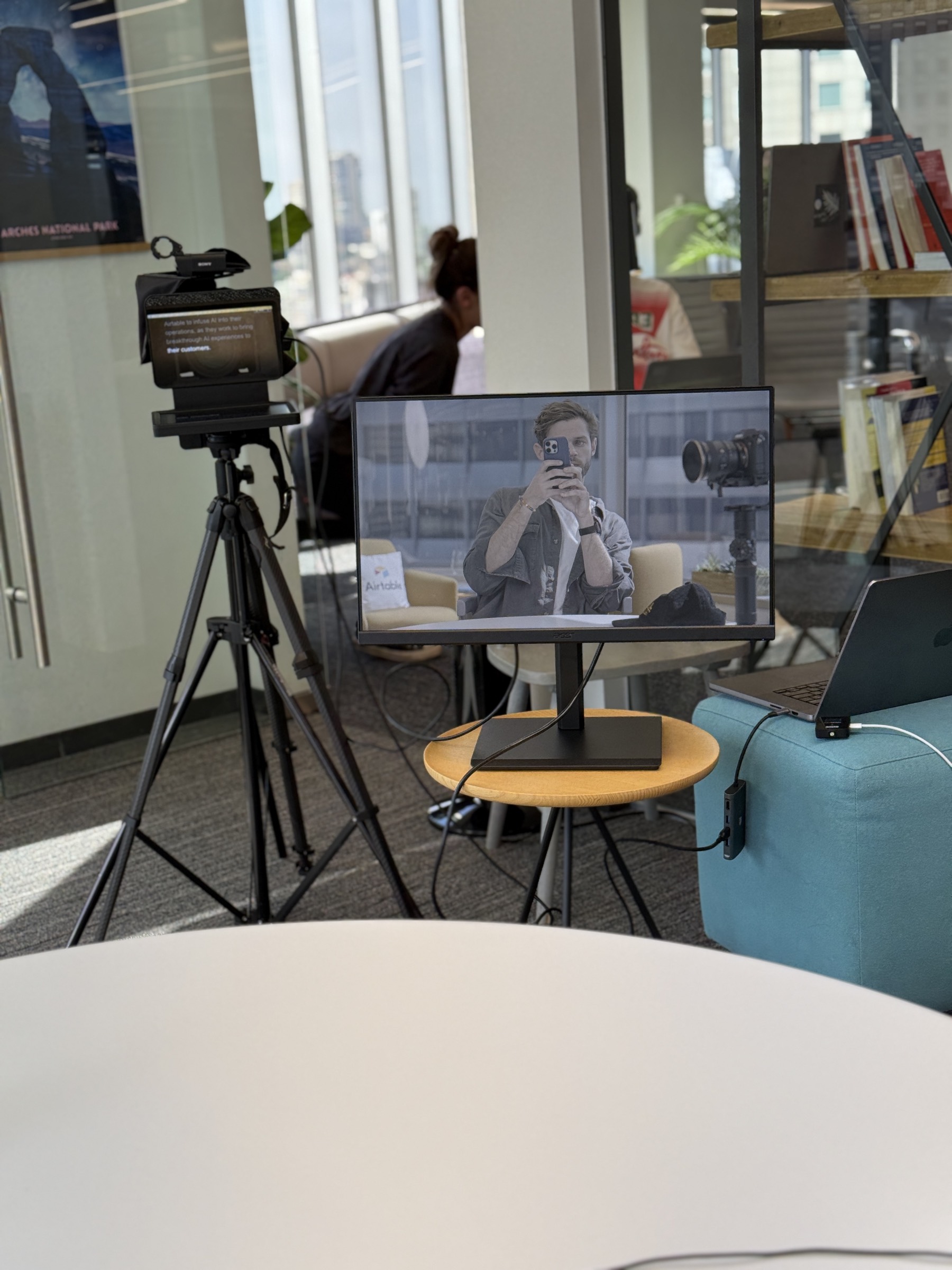 Office interview setup with teleprompter and monitor