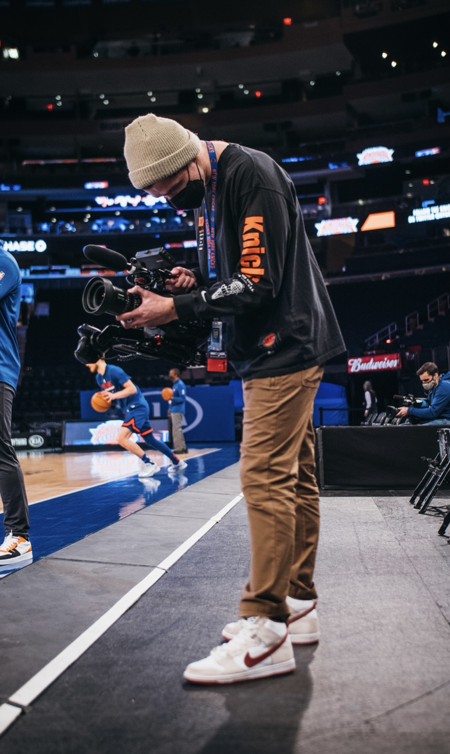 Kevin operating cinema camera courtside