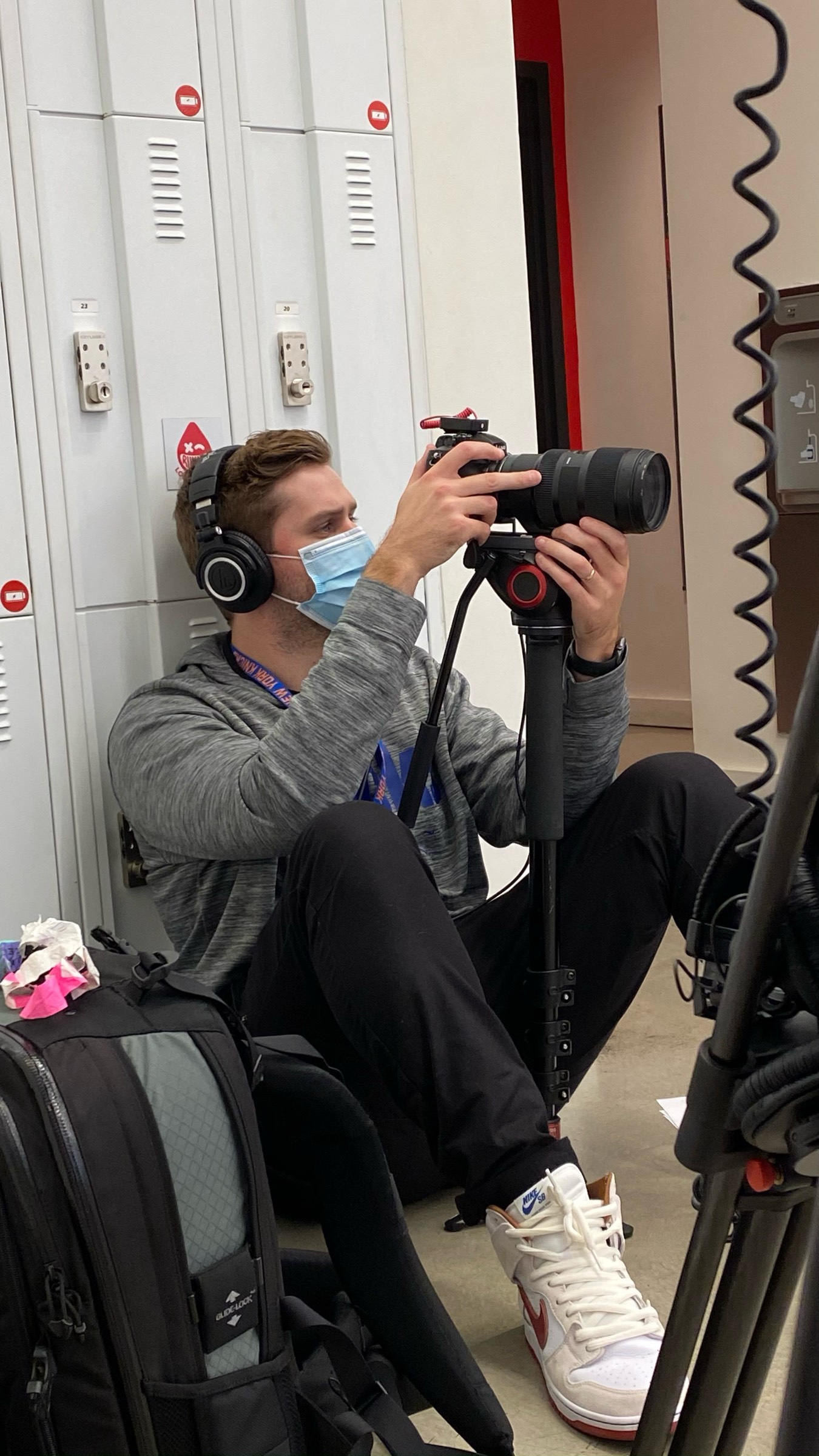 Kevin operating camera in locker room